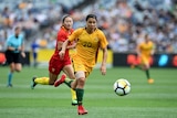 Sam Kerr of the Matildas on the ball against China