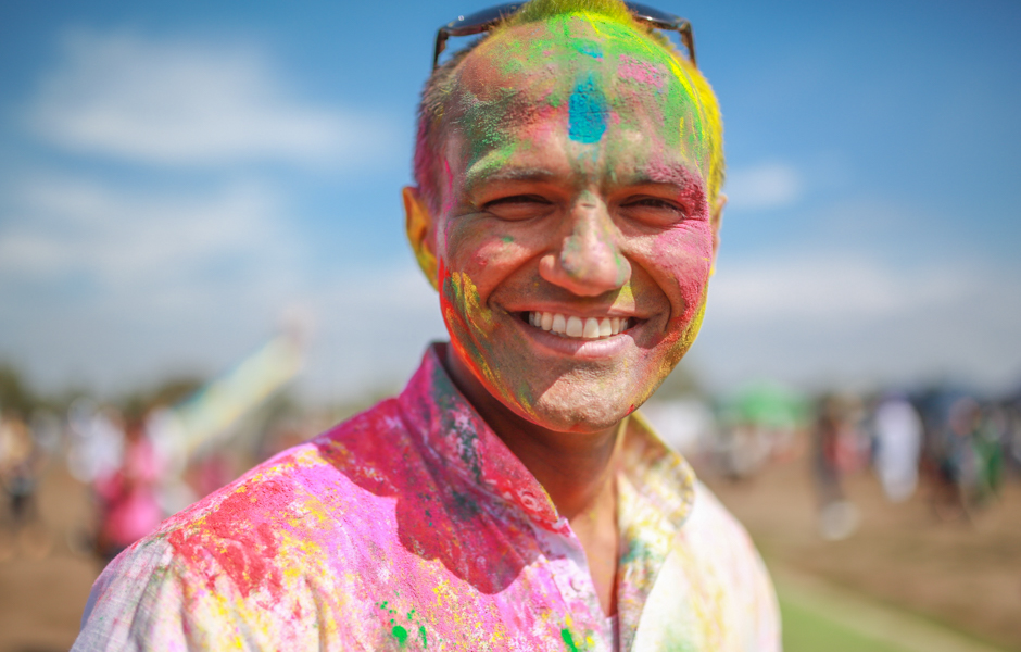 Nitin Singh covered in coloured powder