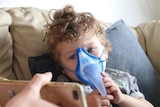 Three-year-Connor, who has cystic fibrosis, wears a breathing mask