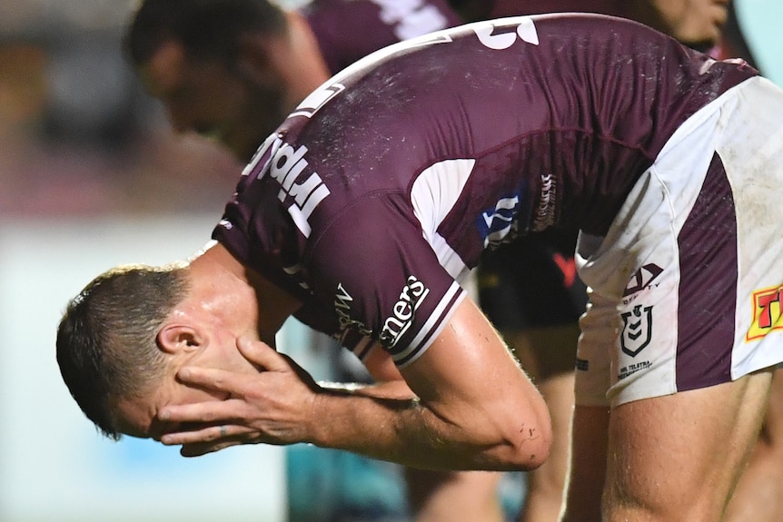 Daly Cherry-Evans holds his head in his hands