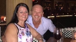 Terry Delaney and her husband Carl at a restaurant.