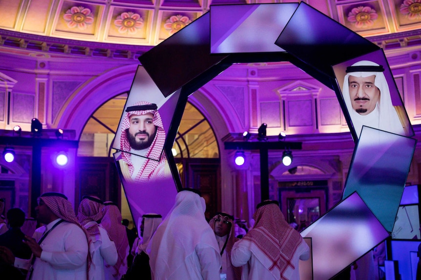 The Crown Prince's picture is displayed on an array of TV screens.