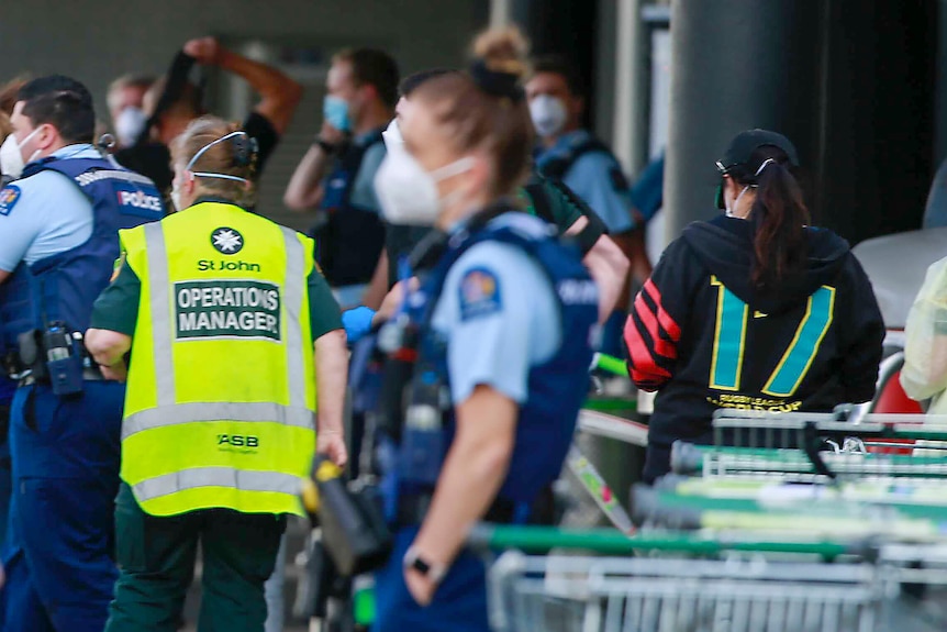 Police and ambulance staff attend the supermarket where the attack took place on September 3, 2021.