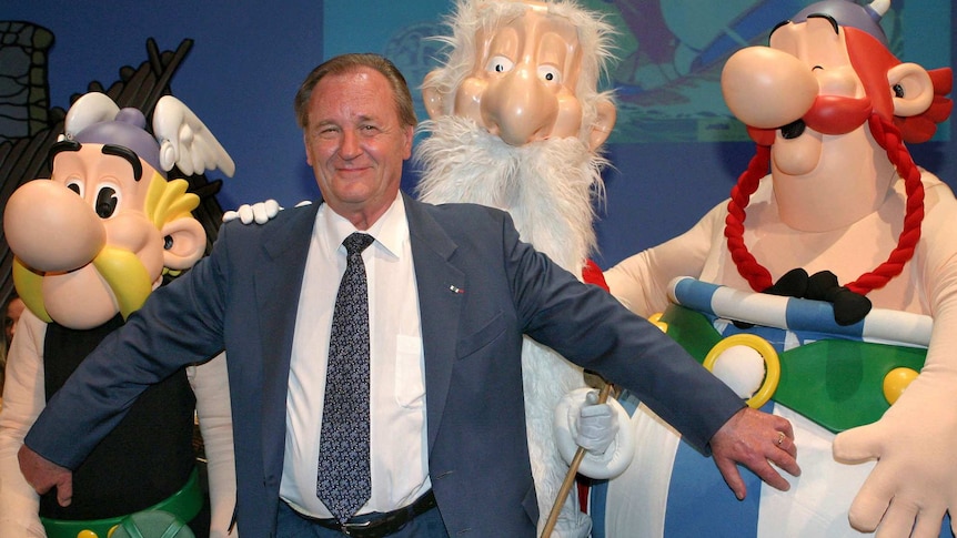 French illustrator Albert Uderzo poses with characters of his famous comics, Asterix.