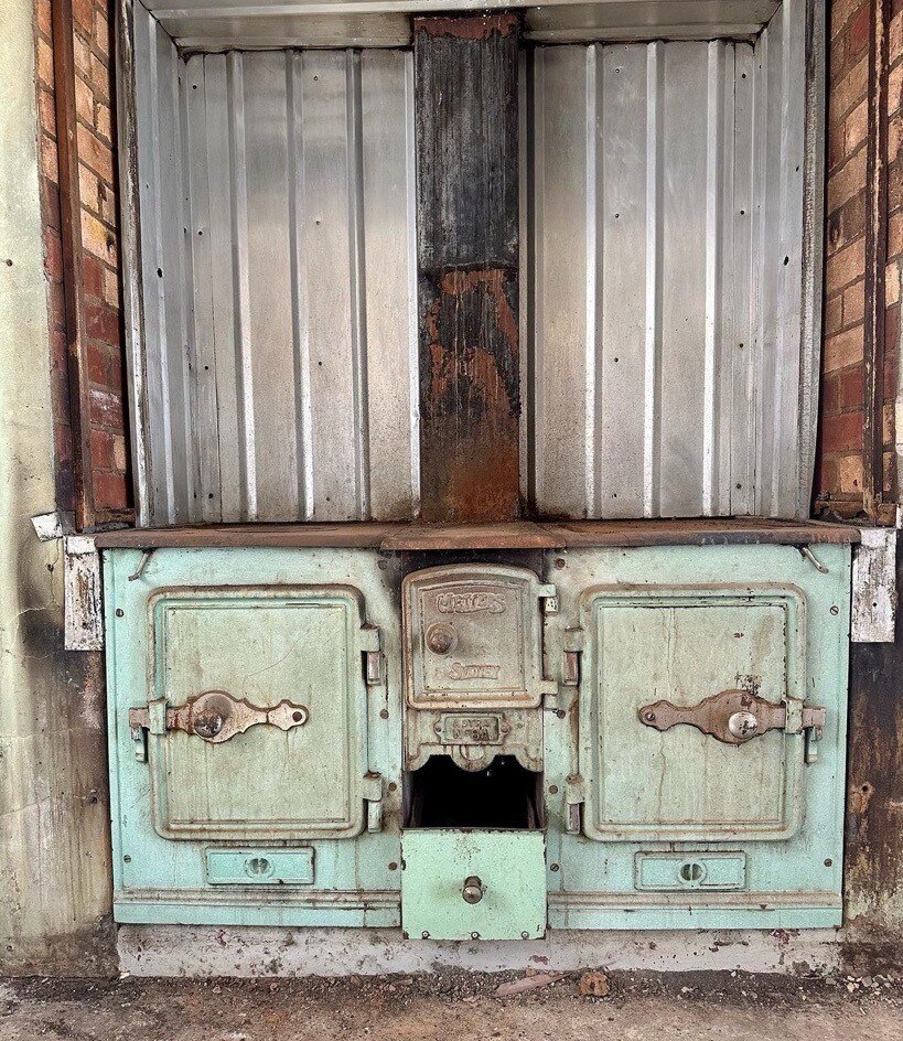The front of an old combustion stove.