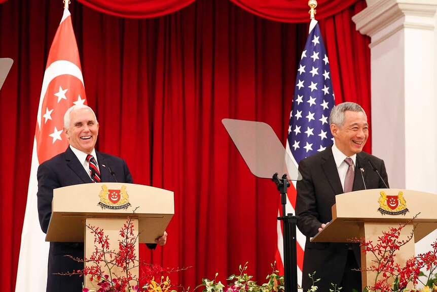 US Vice President Mike Penceand Singaporean Prime Minister Lee Hsien laugh at a joint press conference at the ASEAN Summit.