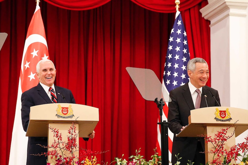 US Vice President Mike Penceand Singaporean Prime Minister Lee Hsien laugh at a joint press conference at the ASEAN Summit.