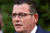 Victorian Premier Daniel Andrews speaks at a press conference outside.