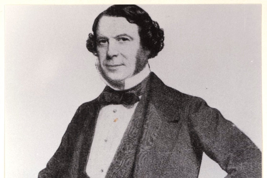 a historical photograph of a man with rather long mutton chops