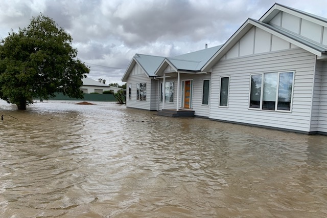 Muddy waters have risen to the bottom step of a house verandah in Birchip.