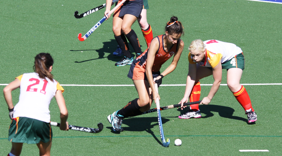 Brooke Peris controls the ball while playing hockey for the NT.