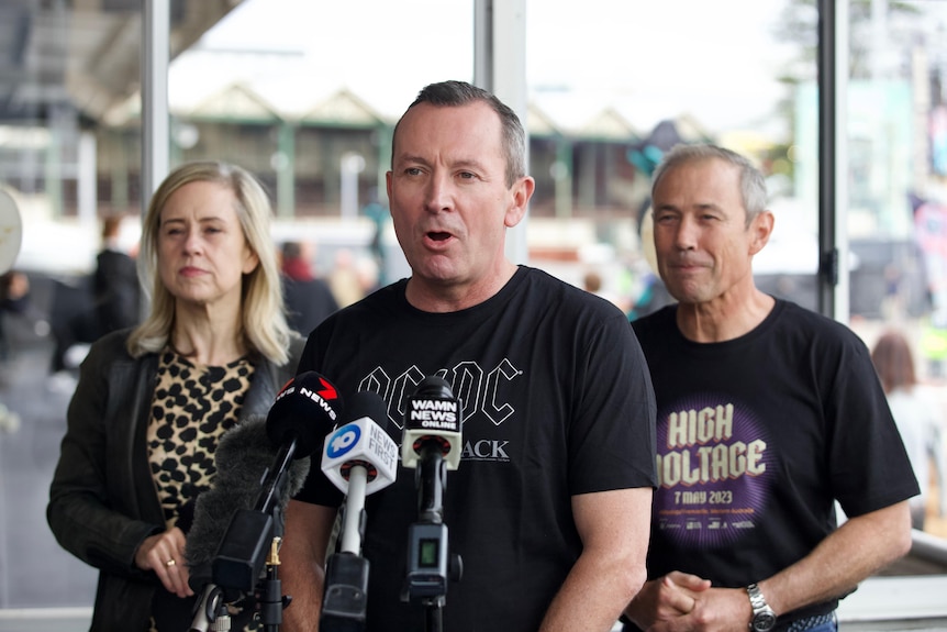 Premier Mark McGowan wearing an AC/DC T-shirt while speaking to the media about the High Voltage event.