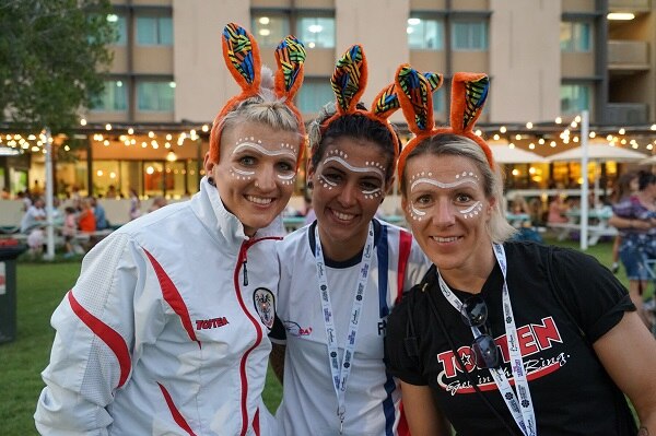 Three women painted up for the Arafura Games.