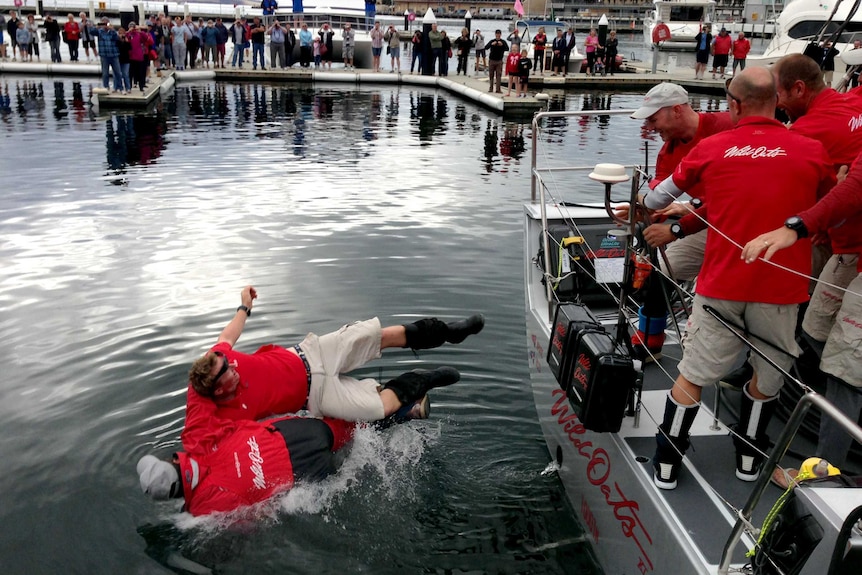 Mark Richards, bottom, is thrown into the water at Constitution Dock.