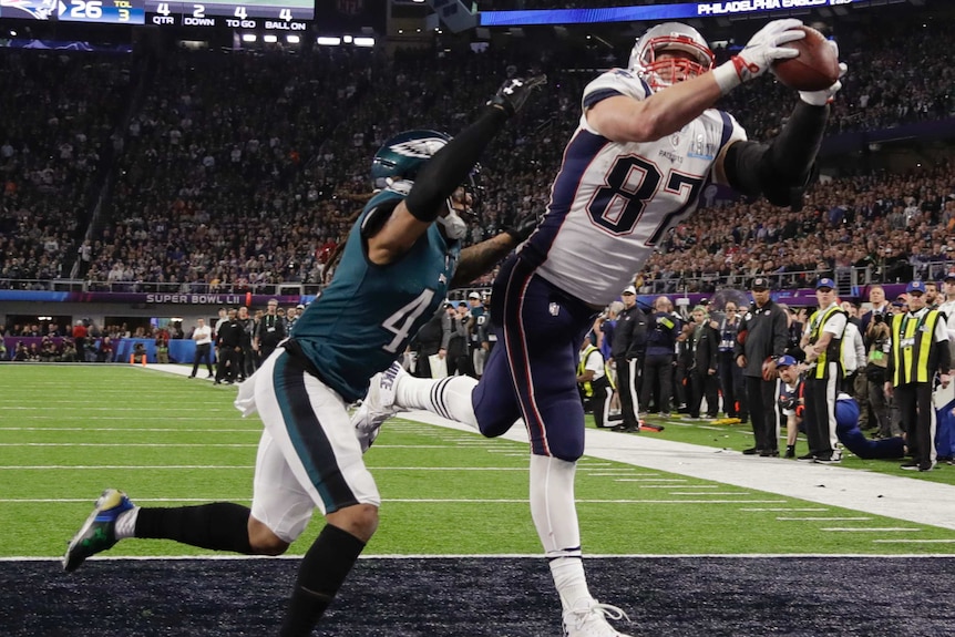 New England's Rob Gronkowski (87) catches a touchdown pass against Philadelphia in Super Bowl LII.