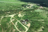 An aerial view taken from a plane of a very green Wave Hill Station