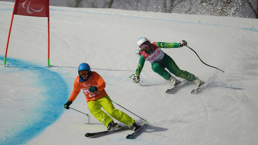 Australia's Melissa Perrine (R) and guide Christian Geiger in women's super combined in Pyeongchang.