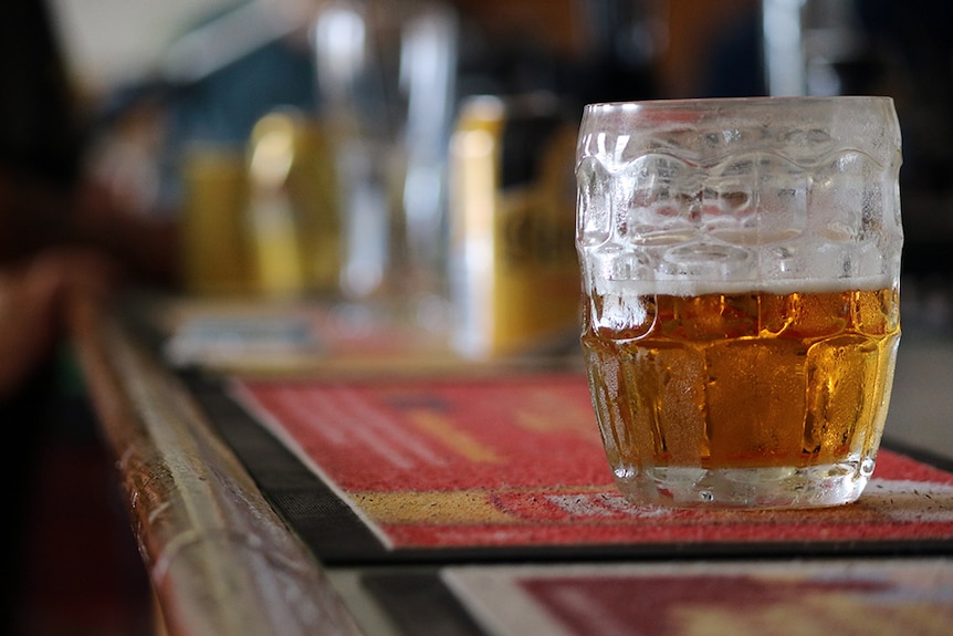 Beer sits on a hotel bar