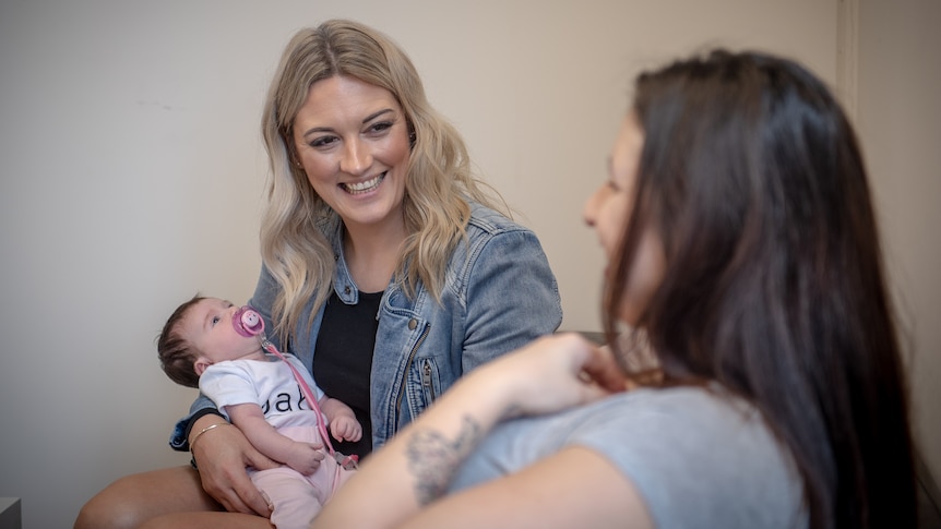 Helen Parker with a participant from The Babes Project and her baby in a story about crisis/unplanned pregnancies.