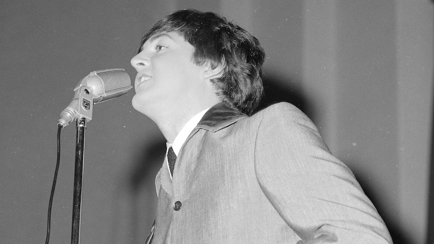 Paul McCartney performs onstage with The Beatles in Adelaide in June 1964.