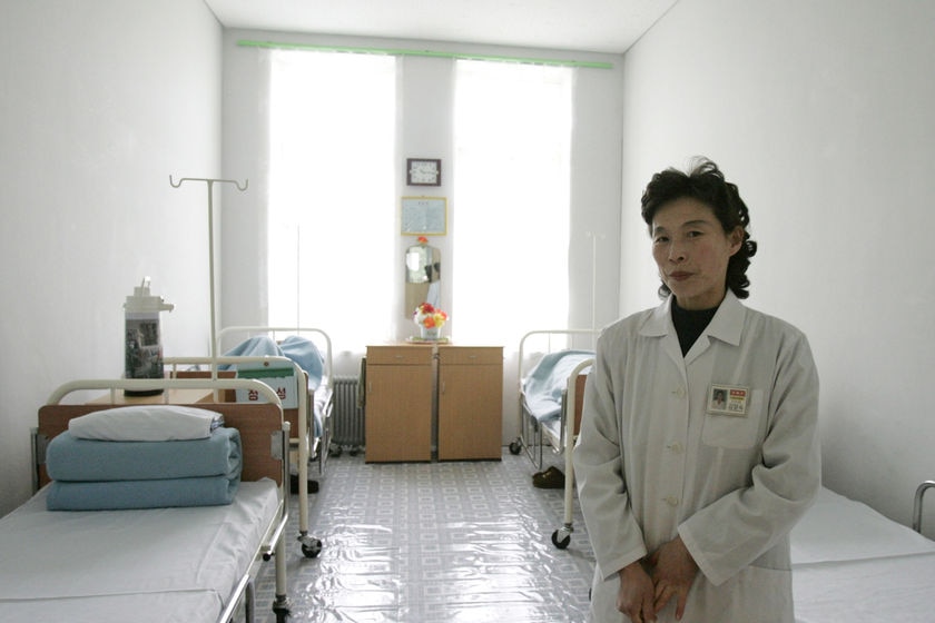 A North Korean nurse stands in a sickroom in a hospital in Pyongyang