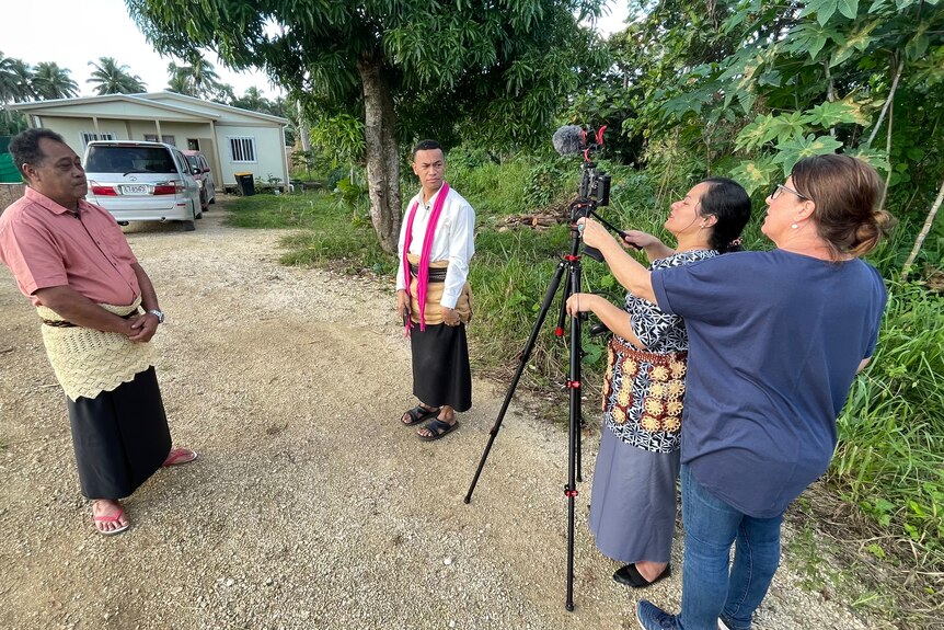 Journalists use a mobile journalism kit to interview a village headman in Tonga 