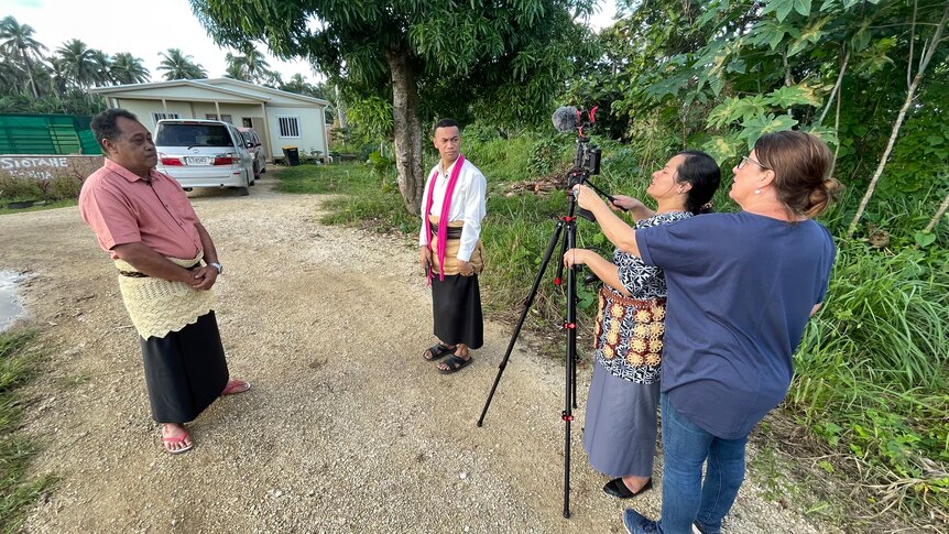 Journalists use a mobile journalism kit to interview a village headman in Tonga 