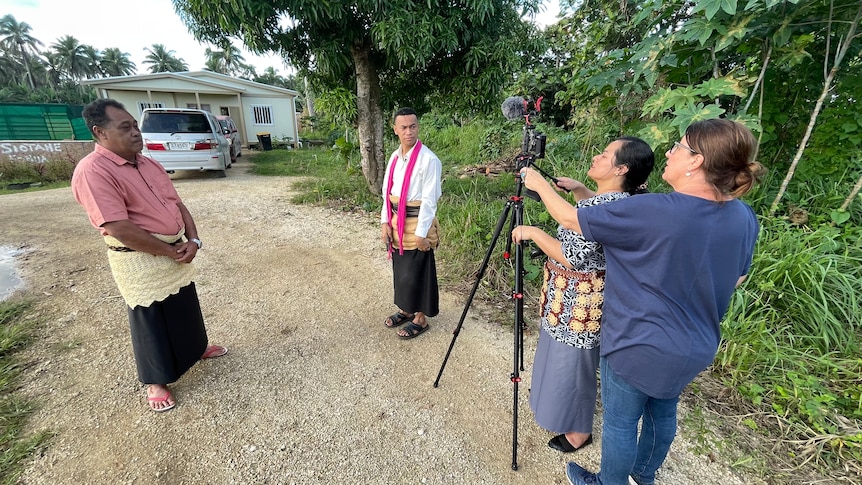 Journalists use a mobile journalism kit to interview a village headman in Tonga 