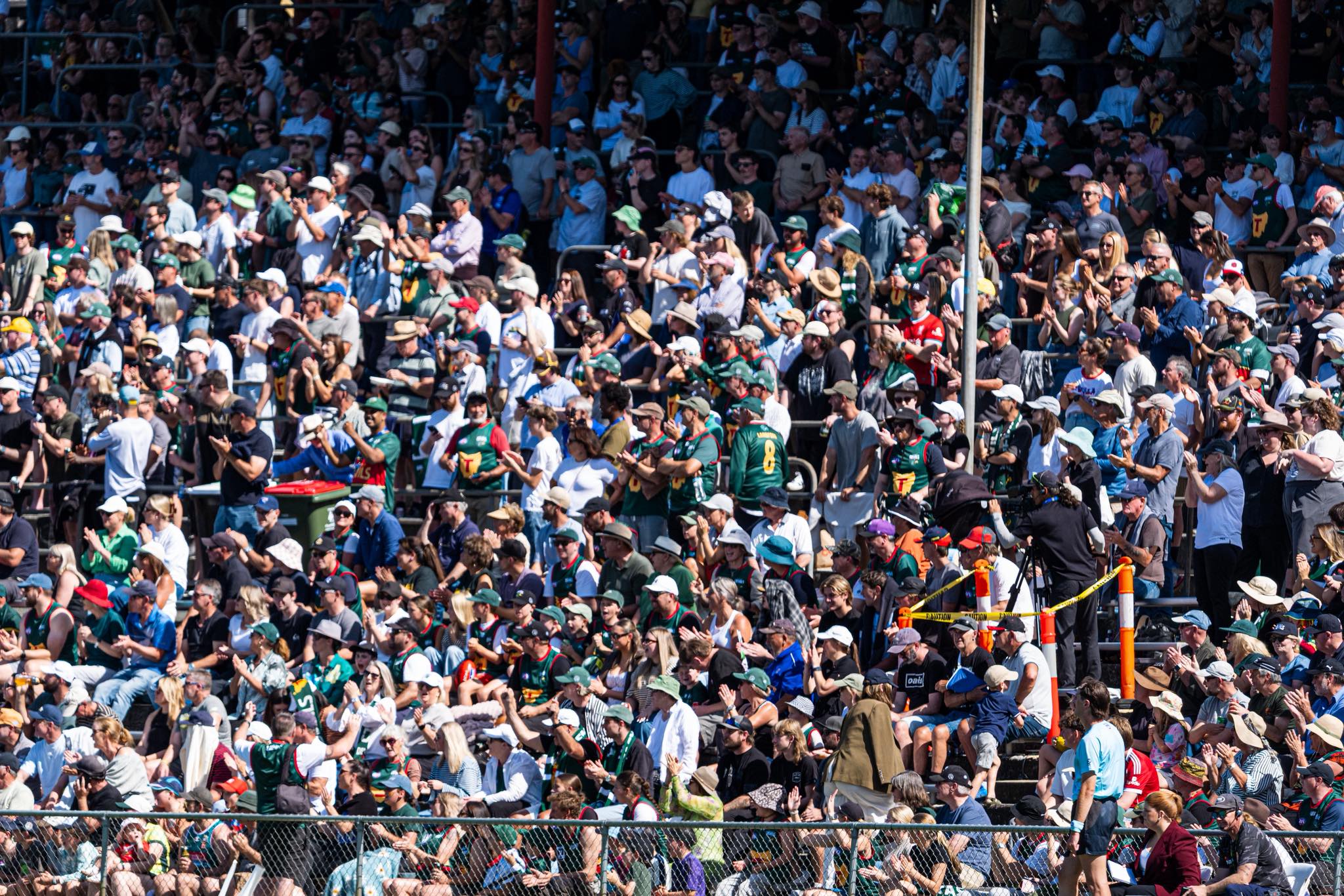 A large crowd in a sports stand.