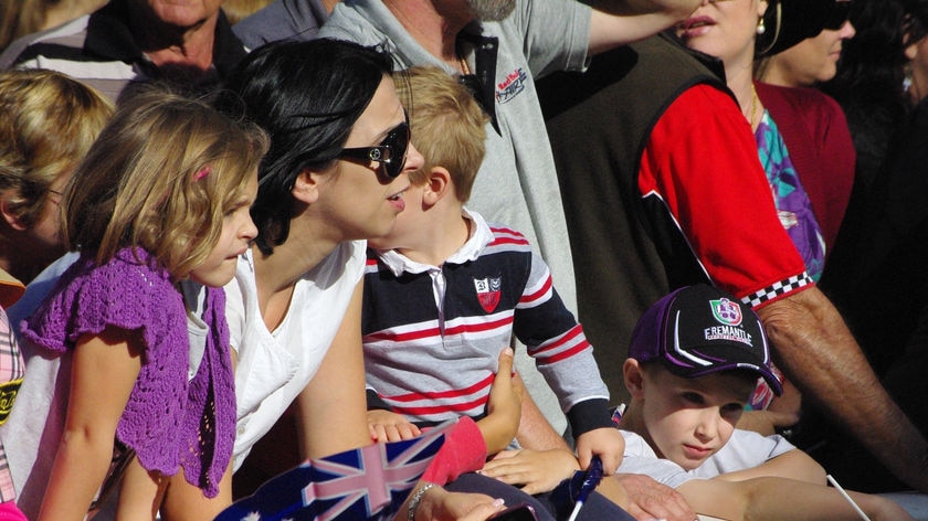 A family watching the ANZAC Day parade in Perth 2010