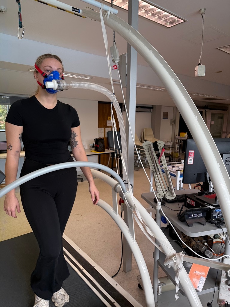 A participant in the UWA binding and exercise study walks on a treadmill while wearing breathing apparatus.