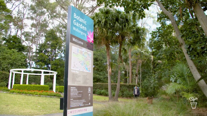 Large public garden with sign 'Botanic Garden Wollongong Welcome'