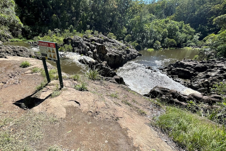 Wappa Falls on the Sunshine Coast where a man drowned on January 2, 2022. A warning sign can be seen.