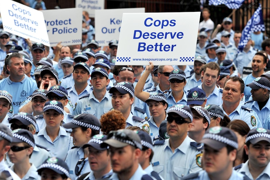 NSW police officers protest outside of NSW Parliament House.