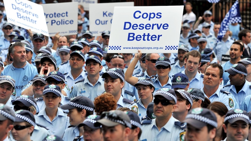 NSW police officers protest outside of NSW Parliament House.