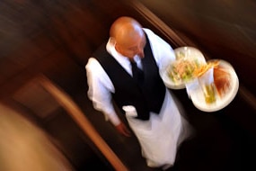 Waiter carries dishes (File image: AFP)