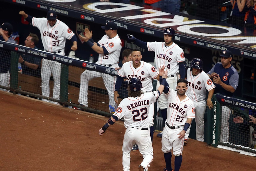 Houston Astros celebrate after scoring a run against the LA Dodgers