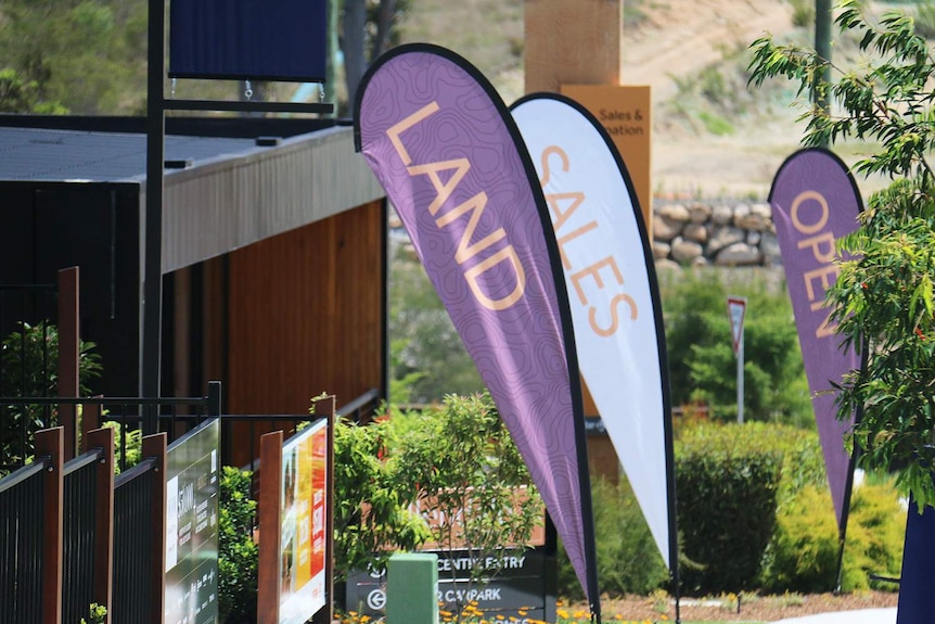 Land sales signs along street at a new housing estate at Ellendale at Upper Kedron on Brisbane's northside in November 2018.