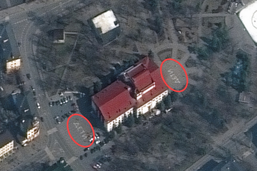 Satellite imagery shows the word "children" painted in Russian in front of and behind the building prior to the bombing.
