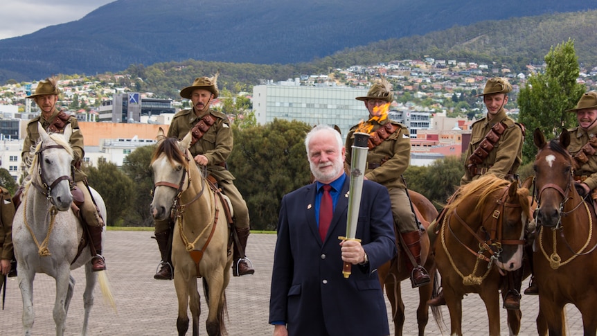 Robert Dick with the Flame of Remembrance and 3rd Light Horse Regiment.