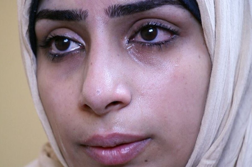 A close up of Haneen who is crying.