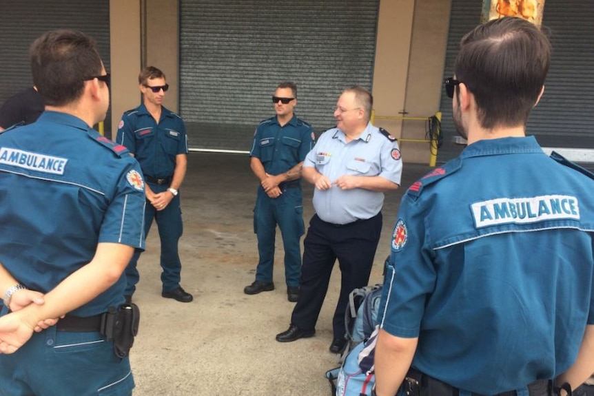 Paramedics are briefed on the situation in rockhampton
