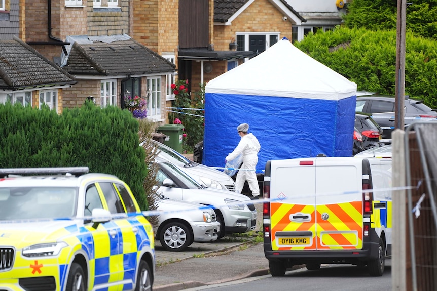 A police tent and forensic officer 