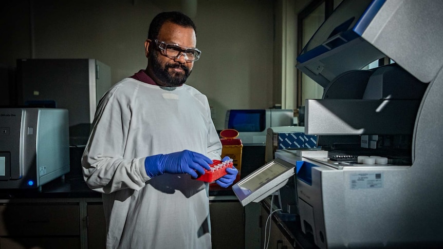 Sudhi Payyappat in a lab with some samples