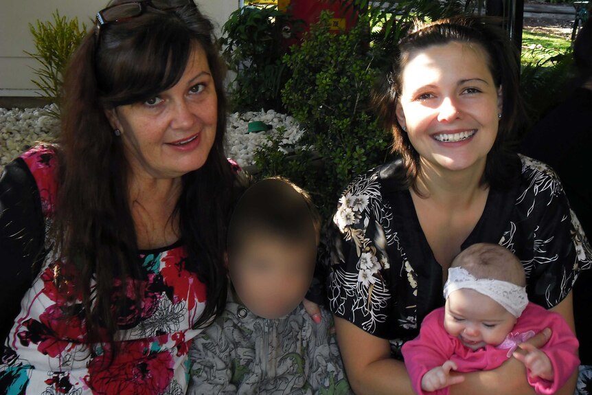 Alison with her adult daughter, Kirra, and two grandkids. The boy's face is blurred