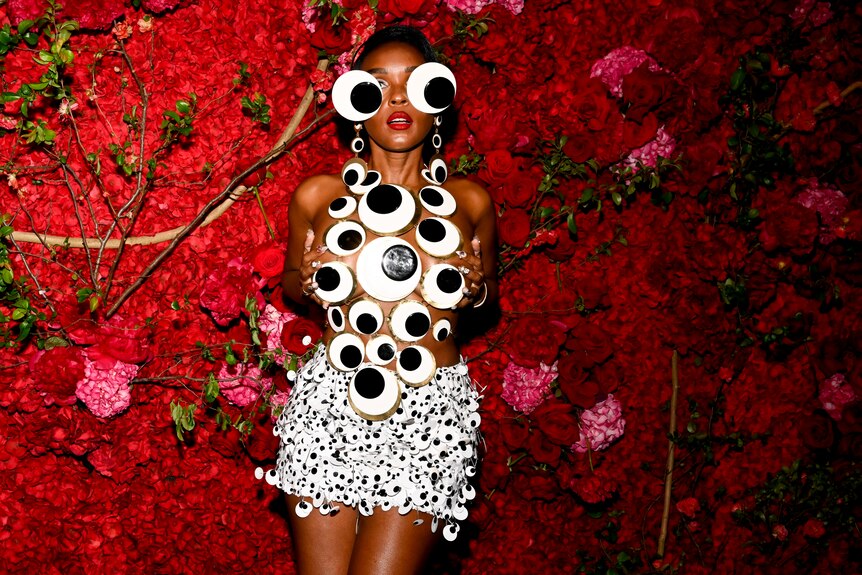 A person wearing googly eyes.