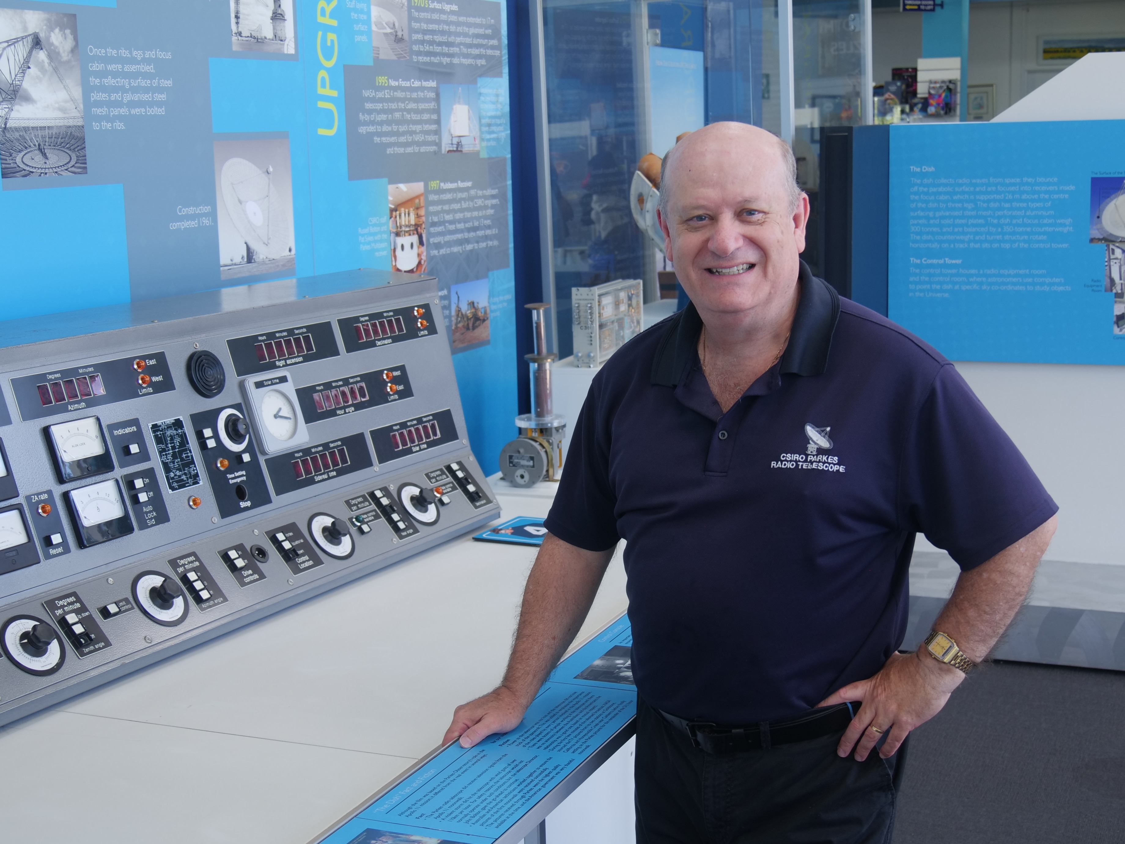 John Sarkissian standing in front of a section of the set