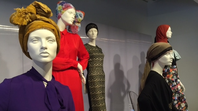 Pieces of clothing on mannequins.