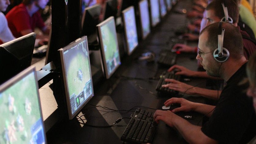 Visitors play at a games convention in the German city of Leipzig, August 2007.