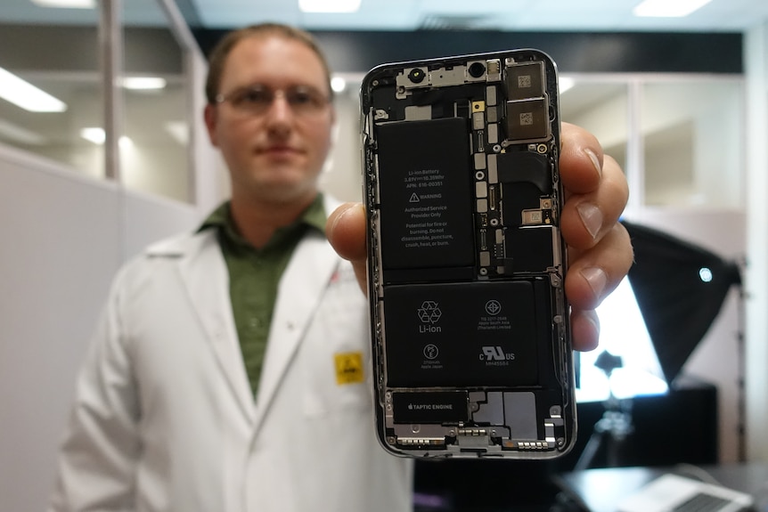 iFixit's Kyle Wiens shows off the insides of the new iPhone X.